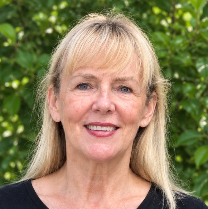 Irena, a Polish language teacher, smiling in a portrait photograph.