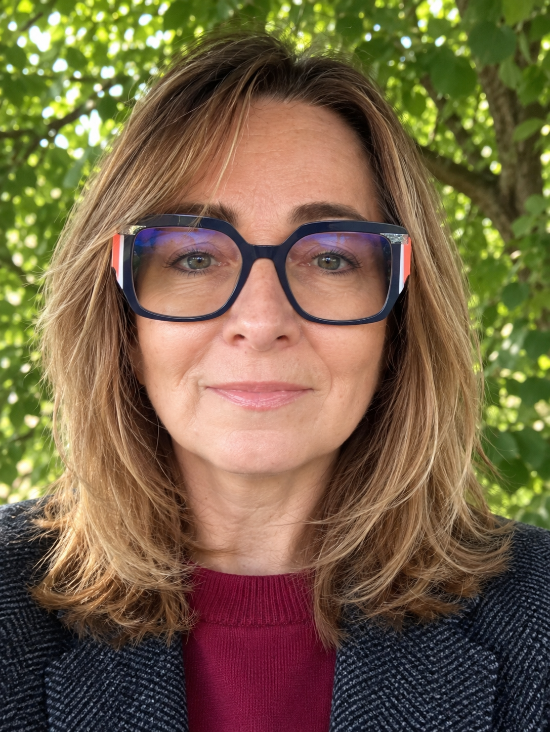 Monika, a Polish language teacher, photographed outdoors.